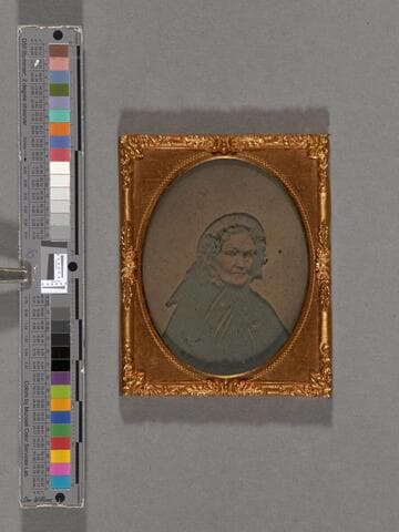 Portrait of a woman in dark bonnet, with cheeks hand-colored [Thoreau - Sewall families?]