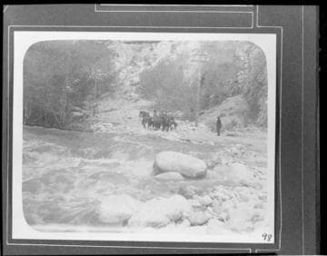 Crew on horseback inspecting the transmission lines during a flood in Santa Ana River Canyon