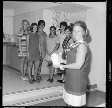 Cooking and electric appliance demonstration to a group of young girls at an Electric Living Center demonstration kitchen
