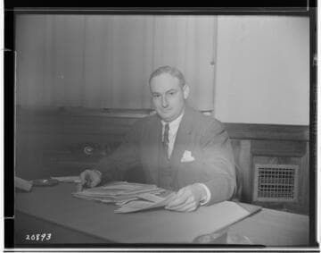 George Hawley at desk (industrial sales head)