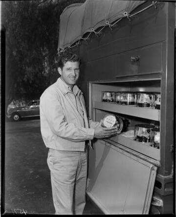 Customer service installer pulling new "one millionth" meter from truck