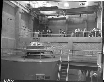 Group touring the interior of the newly operating Big Creek Powerhouse #4 with its two vertical axis, Francis turbine generators