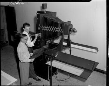 Large copy camera set up over drawing on copy table