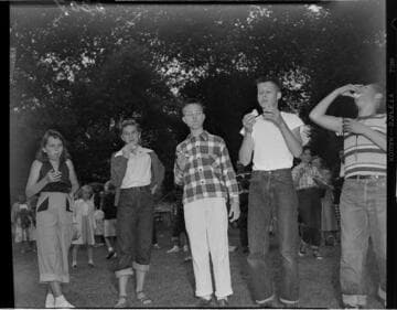 Kids eating at a picnic