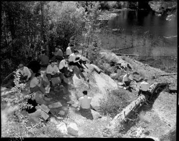 Big Creek tour group eating lunch by a lake