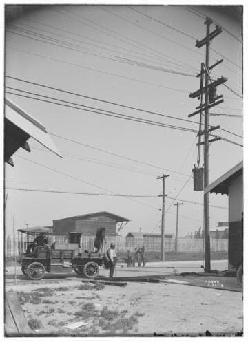 Raising transformer onto pole with electric truck