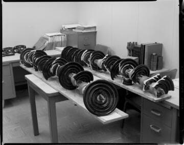 Broken suspension insulators. ; Group with safety award flag. ; Town Hall Award presented to Harold Quinton for Civic Achievement on display
