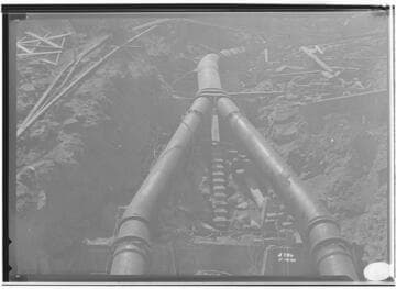 Penstock split before powerhouse for two Pelton type waterwheels