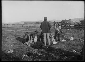 Paiute women gambling near Sparks, Nevada, 1912. Charles Johnson, rancher, standing at center
