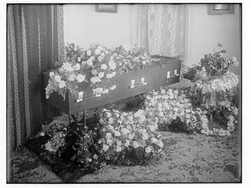Coffin with floral arrangement, Merced Falls, Merced County
