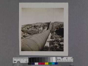 Man and woman pose on pipes of Los Angeles Aqueduct