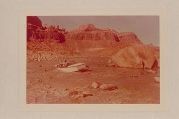 Norm Nevills hung up in Piute Rapid