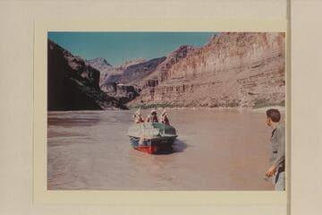 Buzz Belknap handling the "Bootoo" at Whitmore Beach.  Bill Beer is at right