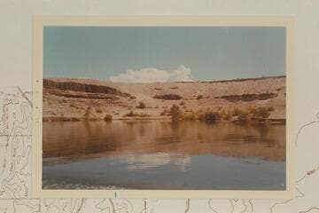 The end of Sandy Point with a barge equipped with experimental equipment