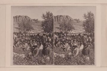 [print from a stereo] U ai Nu Ints.  Rio Virgin.  Ma Nu Ni (all of the tribe, with Mormon and Gentile spectators).  Distributing government goods to the Indians of Southern Utah.  Major Powell at extreme left with a queer hat [Dellenbaugh]