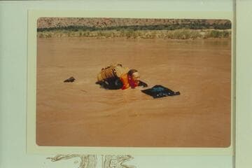 Jorgen Visbak checks his flotation in Granite Park before leaving the mouth of 209 Mile Canyon to float down to Separation Canyon with Bill Mooz and Homer Morgan