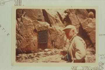 Dock Marston explaining the meanings of the two plaques at Separation Canyon during the History Workshop of Grand Canyon Expeditions, Inc