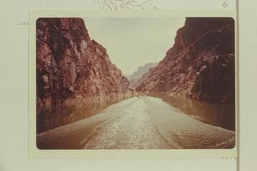Belknap Turbocraft cruising up the canyon at Bridge Canyon Damsite when flow through Glen Canyon Dam had been cut to 1,000 cfs