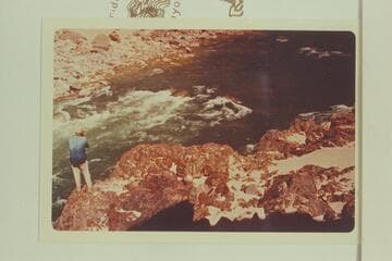 Bill Belknap on left bank of Gneiss Canyon Rapid, photographs test run of Sportyak