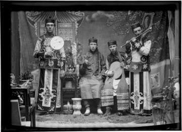 Portrait of four men with musical instruments