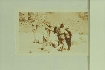 New oars arriving by pack train at Hance Rapid.  LaRue is at left