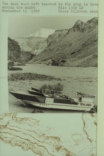 The deck boat left beached by the drop in river level during the night.  Mile 136 1/2 left bank