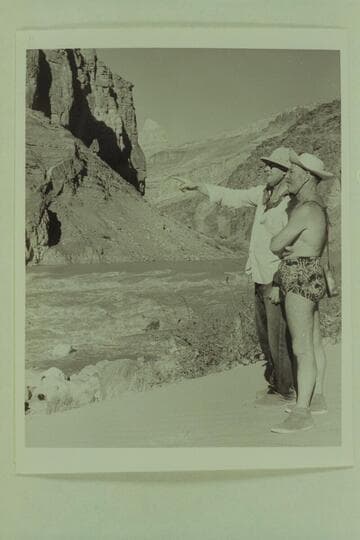 Hudson explains to Marston the course he has selected for the run through Hance Rapid