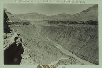 Downriver from Mile 105 1/2 at the Tonto Plateau level.  Serpentine Rapid in middle distance is Mile 106.  In distance at right bank is Stantons Switching Yard