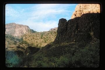 Arch on skyline at Three Springs Canyon, Mile 215.5, right bank