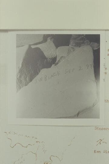 Reeves Baker sits over the "J. W. Black" name which is placed on a rock in a ruin to the left of the Aleson name.  It is situated on the left bank of the Escalante, high in the alcoves of the wall; about 1/4 mile below 25 Mile Wash