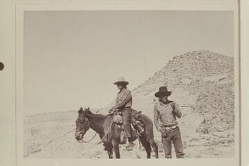 Buck Whitehat and Tobe Owl at upper end of the black brush mesa north of the northeast fork of 73l.6.  Fifty Mile Mountain in distance