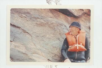 Dock Marston posed at the 1836 D. Julien inscription at Mile 185.75 Cataract Canyon