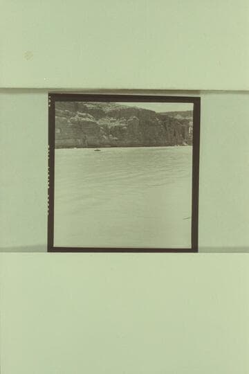 Georgie White and Elgin Pierce leaving Paria Riffle for the Grand Canyon traverse with inflated neoprene boat