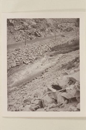 Running a fast flume in Byers Canyon.  Harold Leich in his folding kayak "Rob Roy."  Leich rolled in Byers Canyon, lined the next rapid as well as the last bad section.  He was one hour and 20 minutes through Byers Canyon and made 27-28 miles for the day