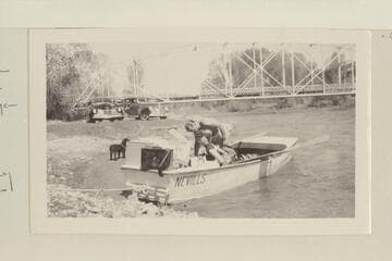 The start of the boat trip down the Dolores River from Dolores, Colorado, to Moab, Utah.  Preparing for start near highway bridge at Dolores, Colorado; Pres and Becky Walker