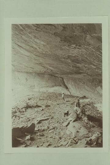 Digging in the Basket Makers Cave, Dolores River.  Margaret Marston in the background.  Pres and Becky Walker in the foreground while Ditty watches operations