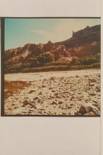 Upriver view along the left bank of the Colorado River showing the gypsum at the mouth of the side canyon which enters at Mile 213