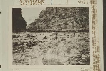 The Eddy crew lining Dark Canyon Rapid.  Eddy photo No. G. C. 37.  Copied from Carey collection