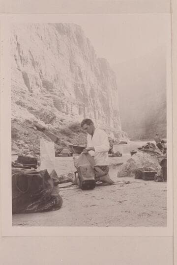 Cooper stowing his dunnage at camp at Mile 41