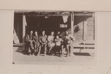 Nequoia Arch Survey; Black Mesa Traverse.  Winter of 1927.  The gang at Robbers Roost Headquarters.  Harold (?) Ekker, Hazel Biddlecome, Arthur Ekker, Millie Biddlecome (with whose baby?), H. Prommel, Pearl Biddlecome in center