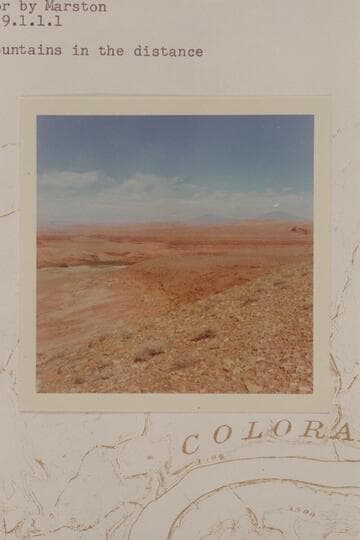 Dugway at left bank of Halls Crossing.  Henry Mountains in the distance