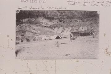First camp set up on north side of river at Lees Ferry by American Placer Corporation.  The fort was used as a cook house.  The three cots at left were brought in by Chicago men