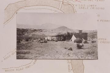 The Fort at Lees Ferry converted into a cookhouse and with the tents which made the first camp set-up on the north side of river