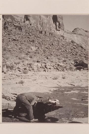 Bill Belknap takes on the fine water in the stream near Whitehat Bridge in Navajo Canyon
