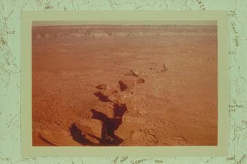 Coyote Gulch from over the point where it joins the Escalante River.  The Straight Cliffs of Fifty Mile Mountain are at top