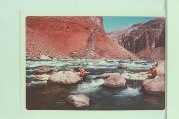 Nosing the small inflated craft at Hance Rapid; Ed Herrman, Howard Booth and Jorgen Visbak