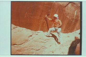 Marston examining Bernheimer's name cut at Redbud Pass between Cliff Canyon and Bridge Canyon