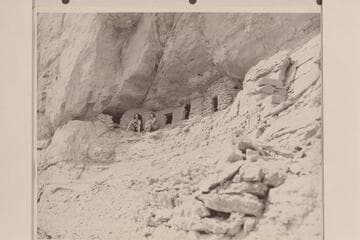Nancoweap Creek; Marble Canyon.  Ros Johnson and Pauline Saylor [also Sailor] at Indian Granaries.  [on photo reverse:  Pauline Sailor and Rosalind Johnson view river from prehistoric granaries 500 feet above water near Nancoweap Creek]