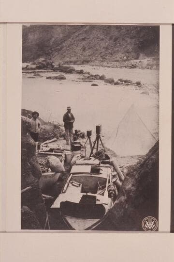 The boats as they were cached below Badger Creek Rapid.  The "Titanic" in the foreground and the Ross Wheeler on the left.  Quist stands at the left
