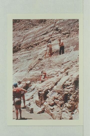 Rigging the camera at Paradise Canyon.  Dick Kelley is at the camera and Doc Reed is hauling gear.  Jim Algar climbs to the camera position.  Gordon Avil handles the line from the beach as Doc Hill looks on